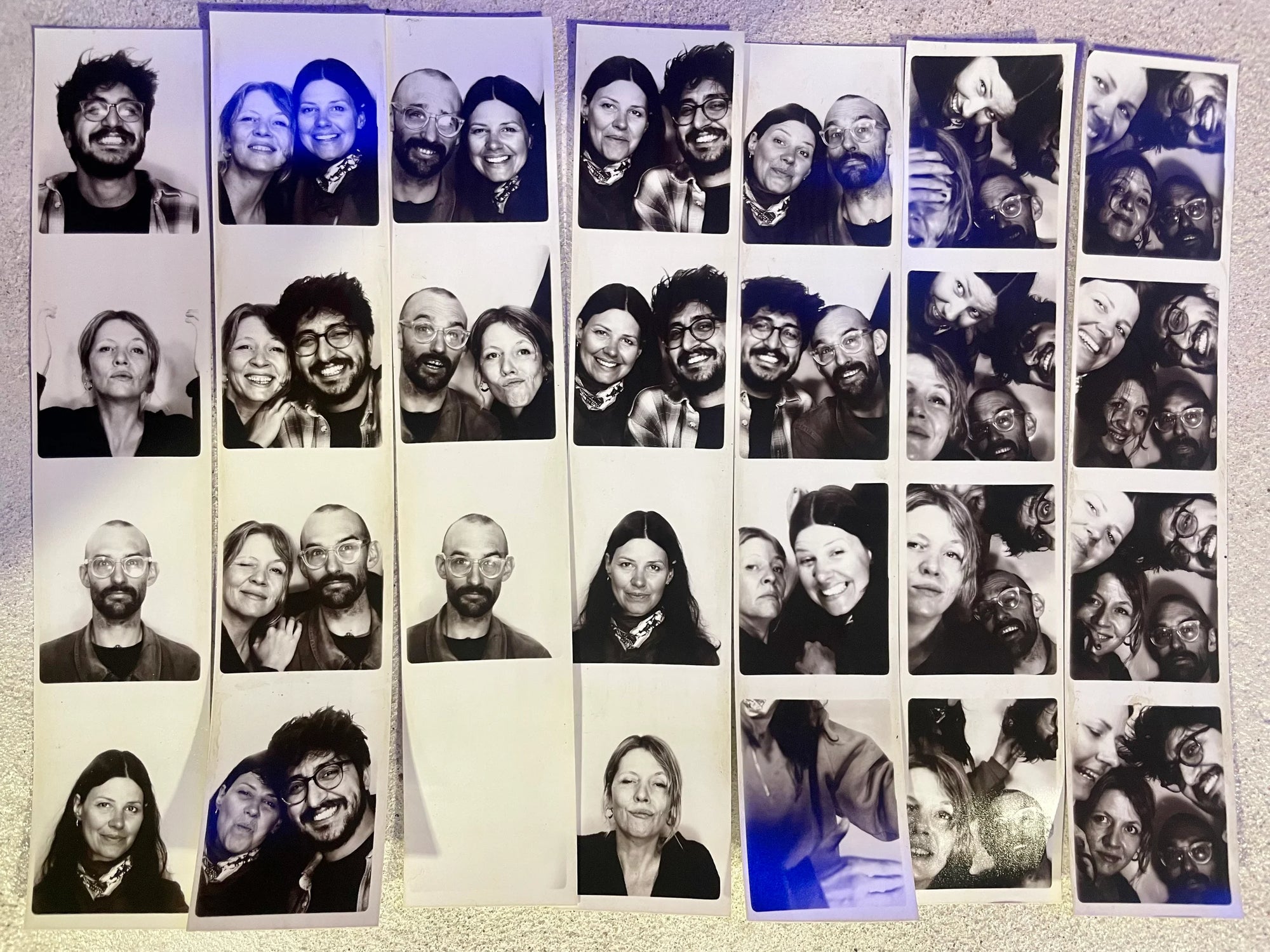 Collage of multiple black and white photos of people arranged in a grid.