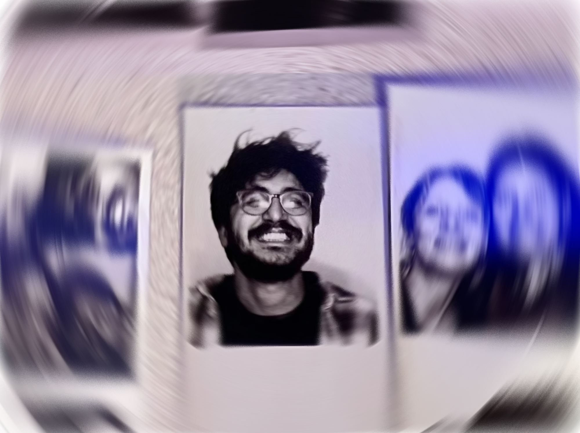 Black and white photo of a man with glasses and a beard.